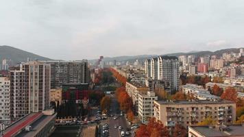 Georgia capital Tbilisi city real estate buildings architecture with street view with cars in sunny autumn day. video