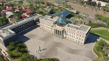 Aerial view of unique presidential palace building with yard and city view panorama video