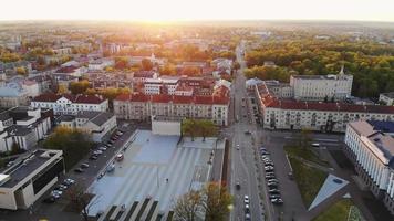 Beautiful panoramic aerial 4K video flying drone above sun city Siauliai panorama in Lithuania. Sunset cinematic Europe destinations
