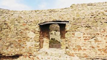 Aerial view Bebris tsikhe fortress old brick wall with window and caucasus panorama video