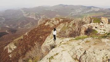 Young girl pose dancing for video in nature. Concept filmmaker couple in scenic nature alone shooting together stock footage.