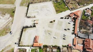 Aerial view Mtskheta empty paid car parking for tourist transport.Post pandemic travel and low tourists season. video
