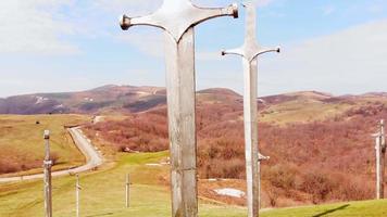 Didgori, Georgia , 2021 - Rising view giant swords in ground. Didgori memorial monument. video