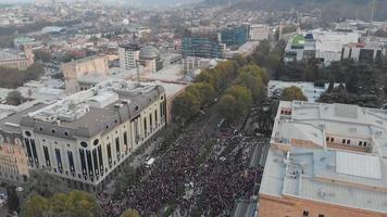 1st november, 2020. Tbilisi.Georgia.Aerial view down to crowds of perople gathered protesting in front of parliament building.Post parliament election protests in caucasus. video