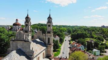 Aerial static view abandoned Church of ascension in capital city Vilnius with street view panorama. Historical landmark attraction destination. Unesco heritage sites Lithuania.