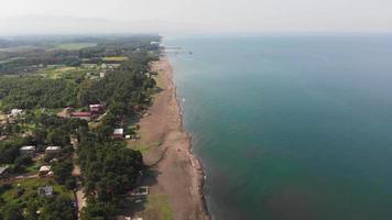 Aerial panoramic fly over black sea shore in Shekvetili village with beauitiful caucasian nature