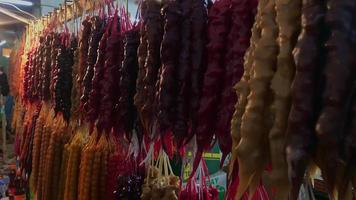 Traditional georgian candy hanging on display market w video