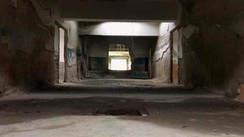 Static view to steam coming out of bath pool underground in Tsqaltubo abandoned spa building. video