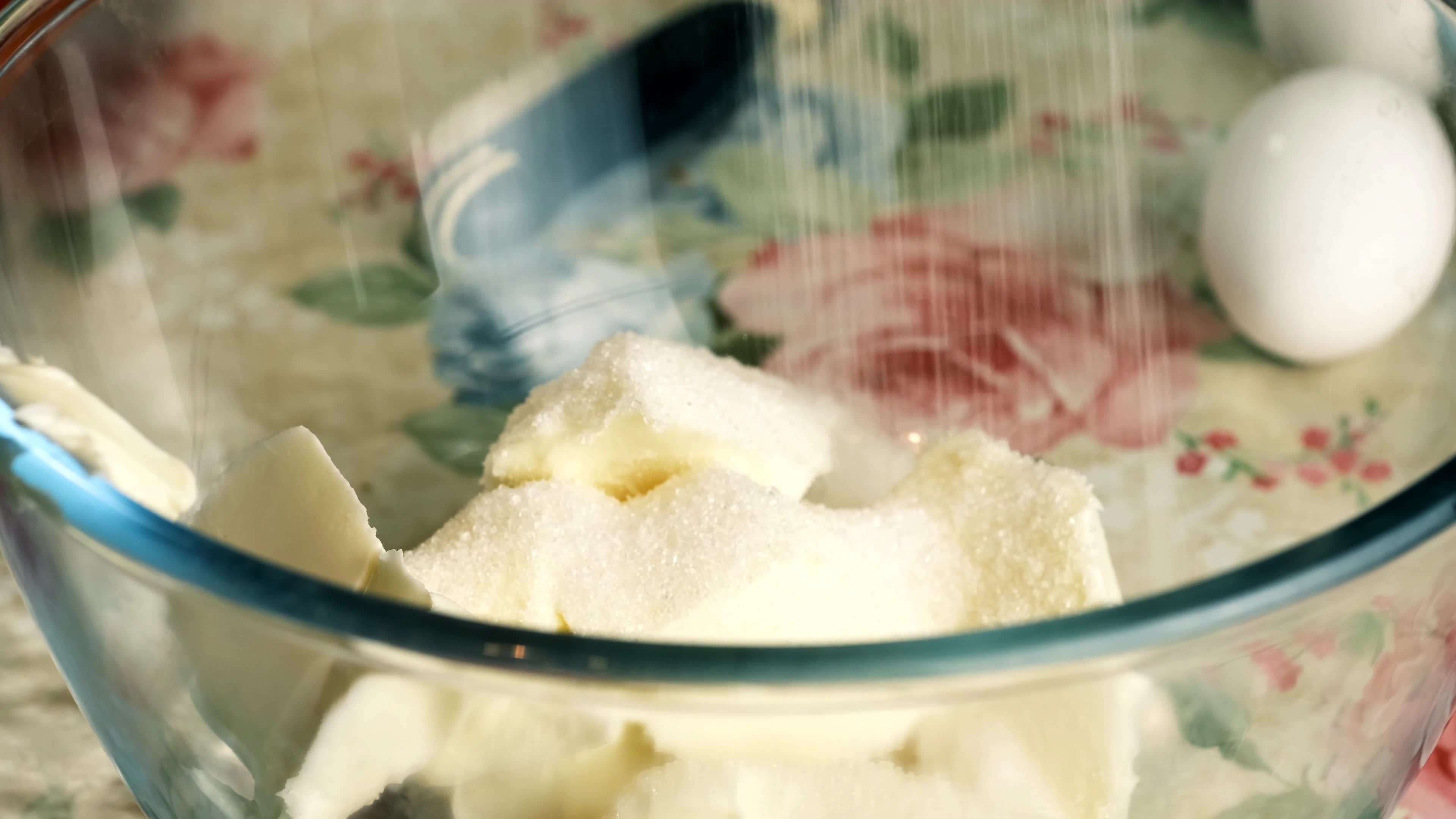 Kneading dough with hand electric mixer. Process of beating the dough