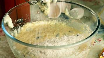 Kneading dough with hand electric mixer. Process of beating the dough using an electric mixer. video