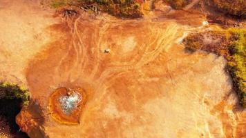 Static top down aerial view orange heart shape form mineral hot spring site in Jermuk holiday resort , Armenia