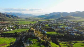 Drone flyover historical Kveshi fortress wall ruins with scenic landscape panorama in southeastern Georgia video
