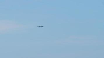 Airplane flies in the blue sky video
