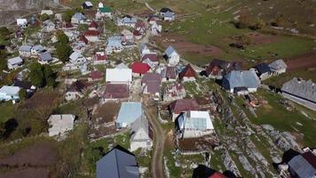 Aerial drone view of mountain village Lukomir in Bosnia and Herzegovina. Unique and traditional village. Unique village in Europe. Medieval traditional way of living. Rural tourism and holidays.
