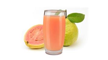 organic guava juice in glass cup isolated on white background with fresh guavas video