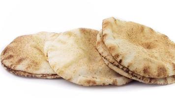 Pita bread isolated on rustic wooden table.Traditional and typical food of Arabic cuisine video