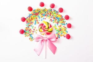 Colorful candy, lollipop and sweets isolated on white background. Top view. Selective focus.