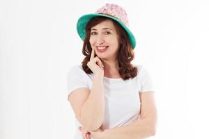 Happy woman in summer hat isolated on white background. Sun protection skin care and vacation holidays concept. Middle age female with white healthy teeth and menopause. Travel vacation. Copy space photo