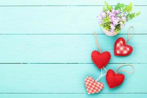 Romantic accessories and copy space on blue wooden background. Top view photo