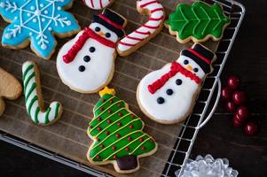 Finished gingerbread and colored face decorations are ready to prepare for Christmas and New Year's celebrations photo