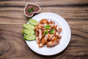 Crispy pork cutlets, ready to eat with fresh vegetables and spicy dipping sauce photo