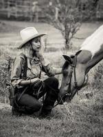 Cowgirl touches the horse with love Because of relationships that are friends who share suffering and happiness together photo