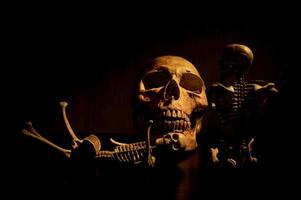 Still life art of a human skull on a black background photo