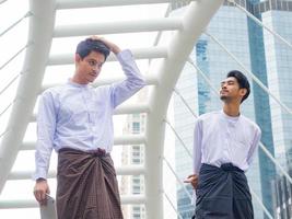 Young Burmese businessmen meet and talk about their business photo