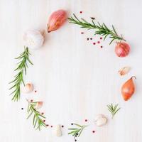 Round frame with seasonings. Ring food background with spices, rosemary photo