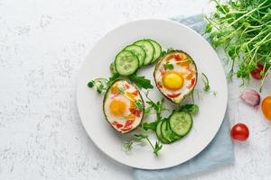 egg baked in avocado, toast, breakfast, top view, copy space photo