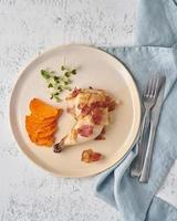 Chicken leg with batata and bacon, fodmap keto ketogenic diet, top view closeup