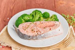 Steam salmon, broccoli, paleo, keto or fodmap diet. White plate photo