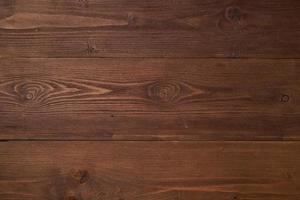 fondo de madera marrón oscuro con madera de pino, estructura de madera con nudos foto