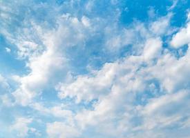 Blue sky and beautiful white clouds. Bright sunny day. Background with copy space photo