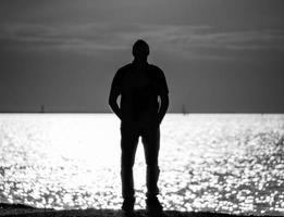 silhouette of man on the Gulf of Finland in St. Petersburg, a man looking into the distance photo