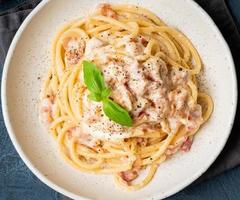 Carbonara pasta. Spaghetti with pancetta, egg, parmesan cheese photo