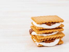 Smores, marshmallow sandwiches - traditional American sweet chocolate cookies photo