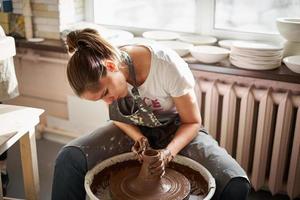 Woman freelance, business, hobby. Woman making ceramic pottery photo