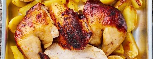 Long banner with Grilled chicken meat, leg, thigh with baked potatoes photo