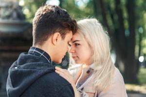 Girlfriend and Boyfriend are looking at each other in the park, concept of love and happiness photo