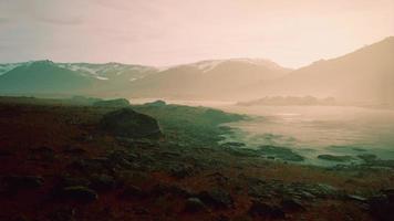 Beautiful view of foggy mountains with a reflection in a lake video