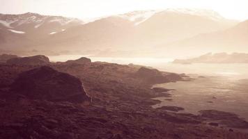 Beautiful view of foggy mountains with a reflection in a lake video