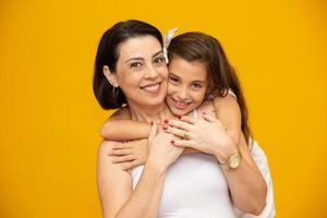 Mothers day concept. Mother and daughter hugging photo
