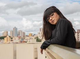 Successful smile businesswoman on top of a building. photo