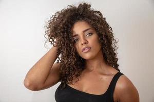Beauty portrait of african american woman with afro hairstyle and glamour makeup photo