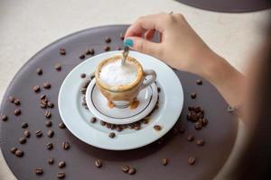 Woman drinking coffee table. Women in cafe. photo