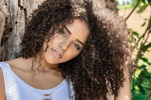 Beautiful model afro american woman in a natural setting. Brazilian young woman. photo