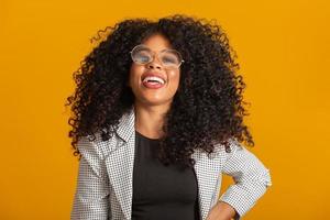 Afro woman smiling at the camera with your glasses
