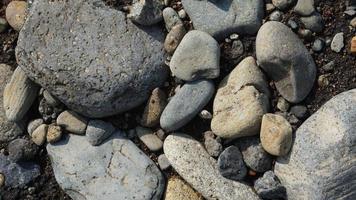 fondo de roca de río. patrón de piedra marina. textura de piedra foto