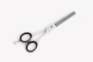 Barber scissors for sculpting isolated on white background. Stylish professional hairdressing scissors photo